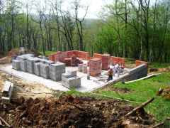 The monomur walls rise on Tuesday morning