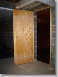 I hung a battened door and fitted a lock.